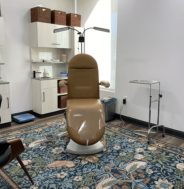 lifestyle solutions office with brown chair and teal rug